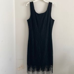 Black dress size 8 fringes around the tail nice little black dress